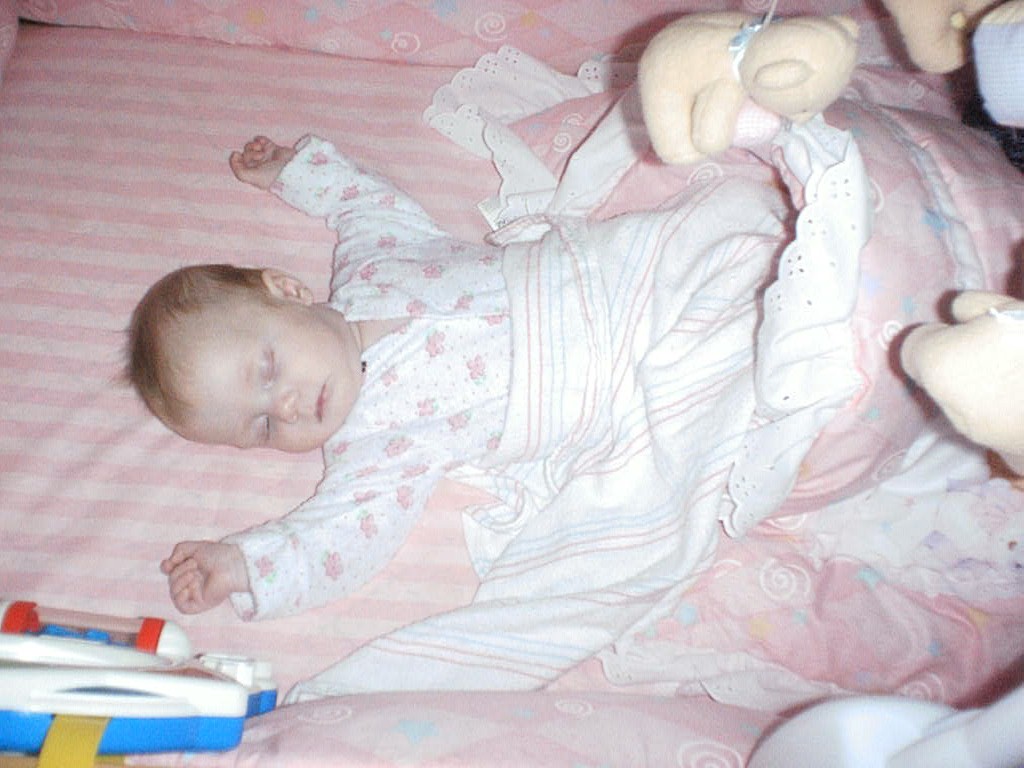 Sleeping in her crib
