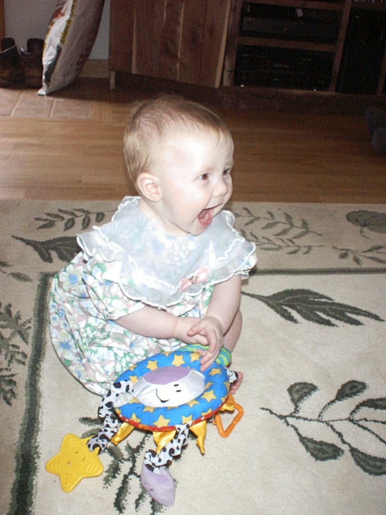 Sitting up in her Easter outfit